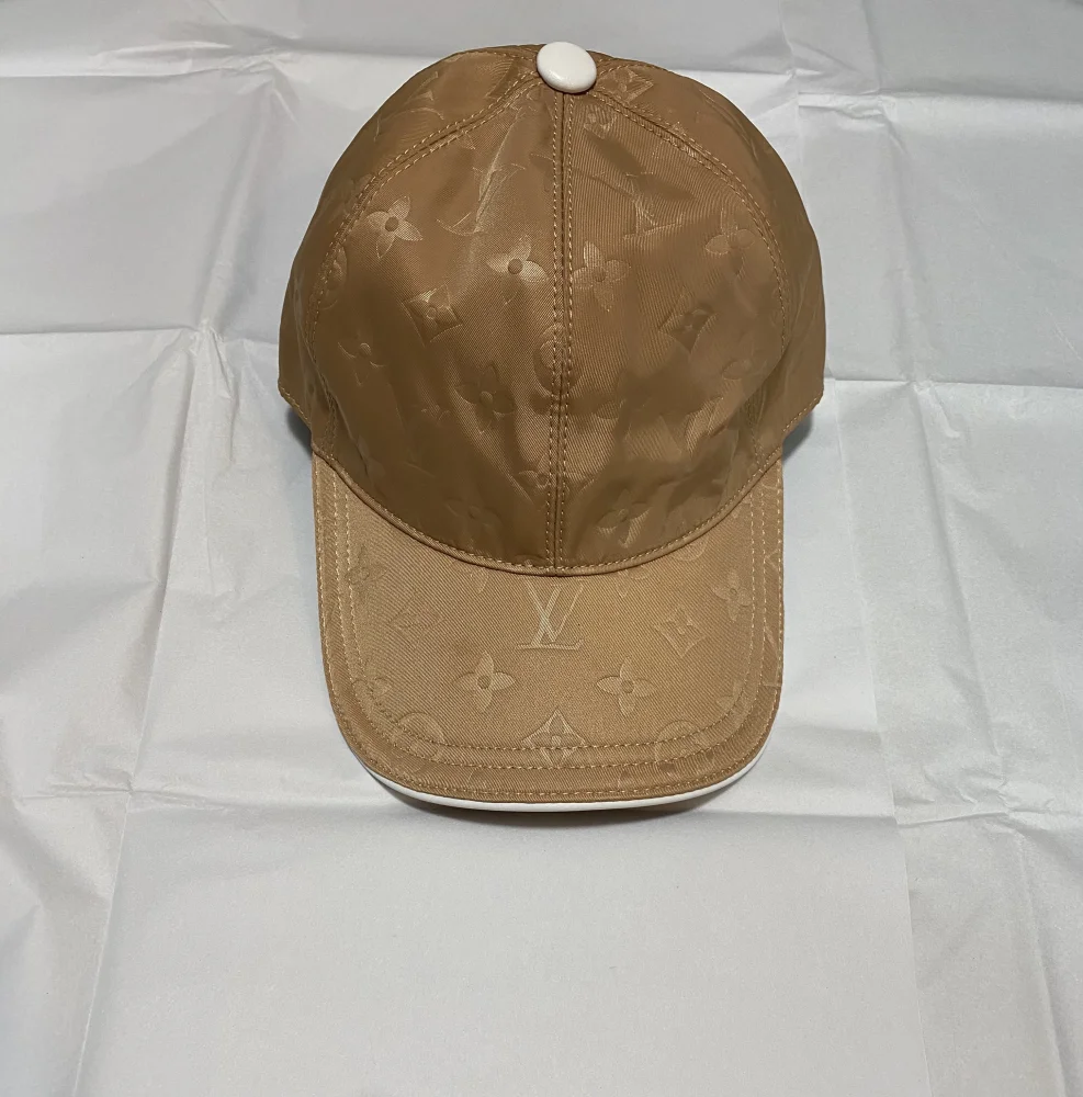 Louis Vuitton Cap Beige Glossy  | MASSIMOLUXURYOUTLET